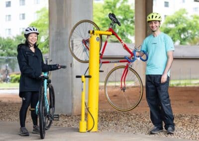 Man and woman using bike repair stand
