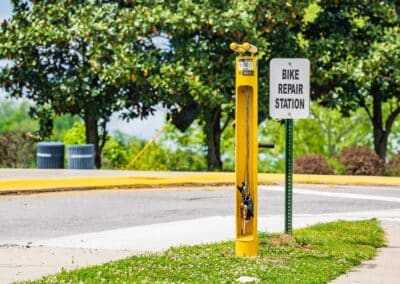 Yellow bike repair stand with "Bike Repair Station" sign